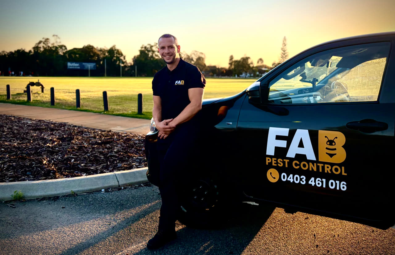 Fabien from FAB Pest Control beside the branded FAB Pest Control vehicle in Perth