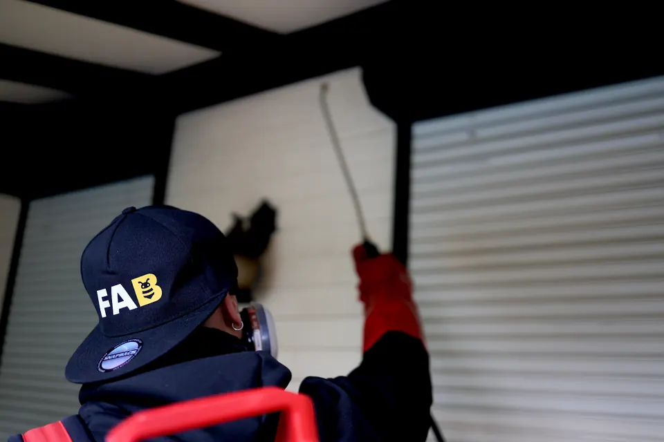 Fabien from FAB Pest Control preparing equipment for an end-of-lease pest-control service.